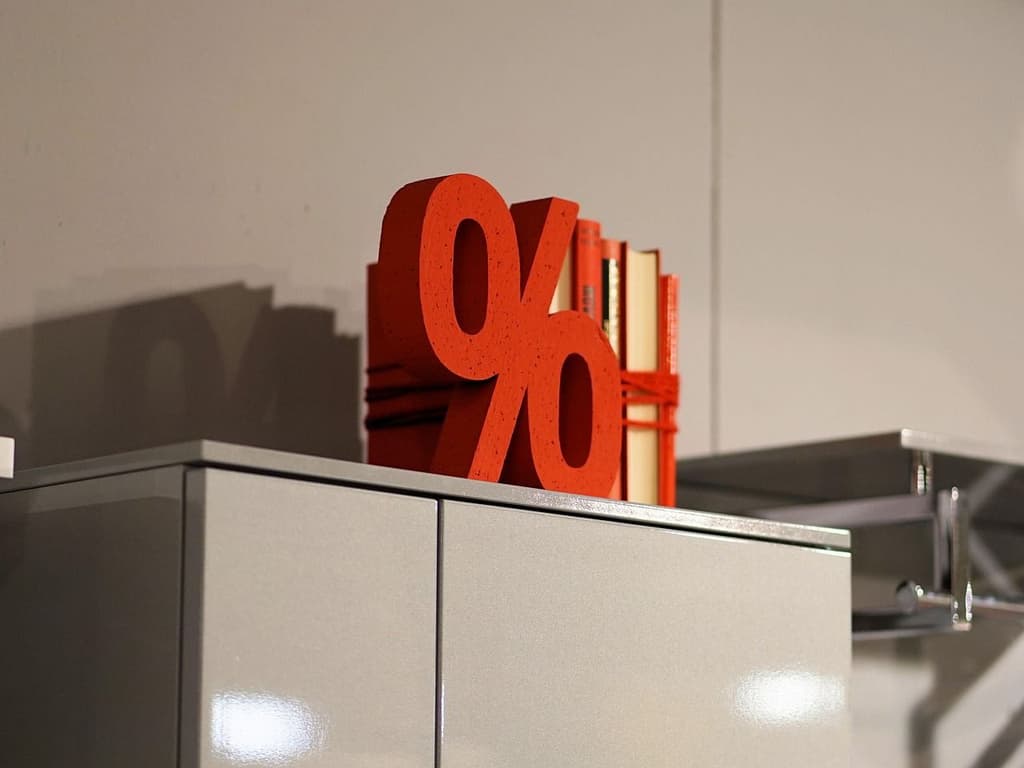 A percentage symbol on top of a cabinet