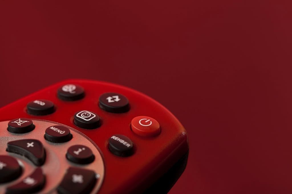 TV remote control in a red background