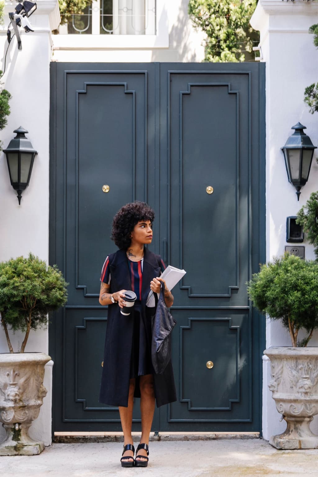 Woman standing in front of a hotel front door