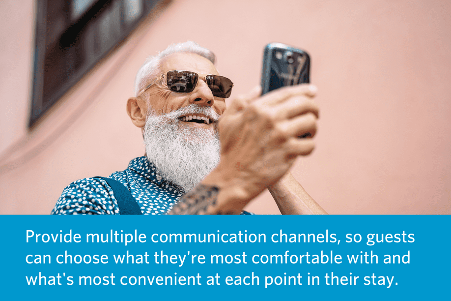 a man walking outside with a backpack on, looking at a cell phone and smiling with article quote below: Provide multiple communication channels, so guests can choose what they're most comfortable with and what's most convenient at each point in their stay.