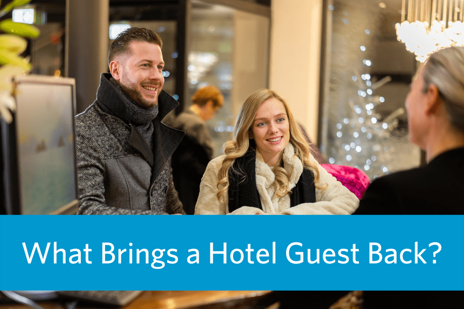 a man and a woman at a hotel front desk smiling at a hotel employee with article title text overlay: What Brings a Hotel Guest Back?
